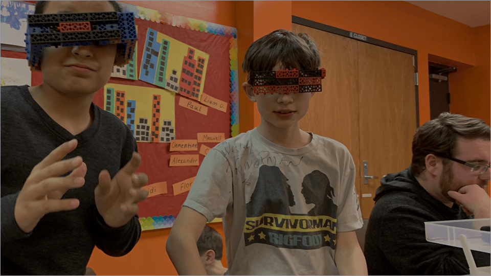 RoboThink franchise owners and students in a hands-on STEM session